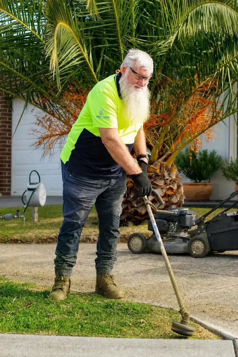 Line trimming a clean edge along a driveway in Hoppers Crossing
